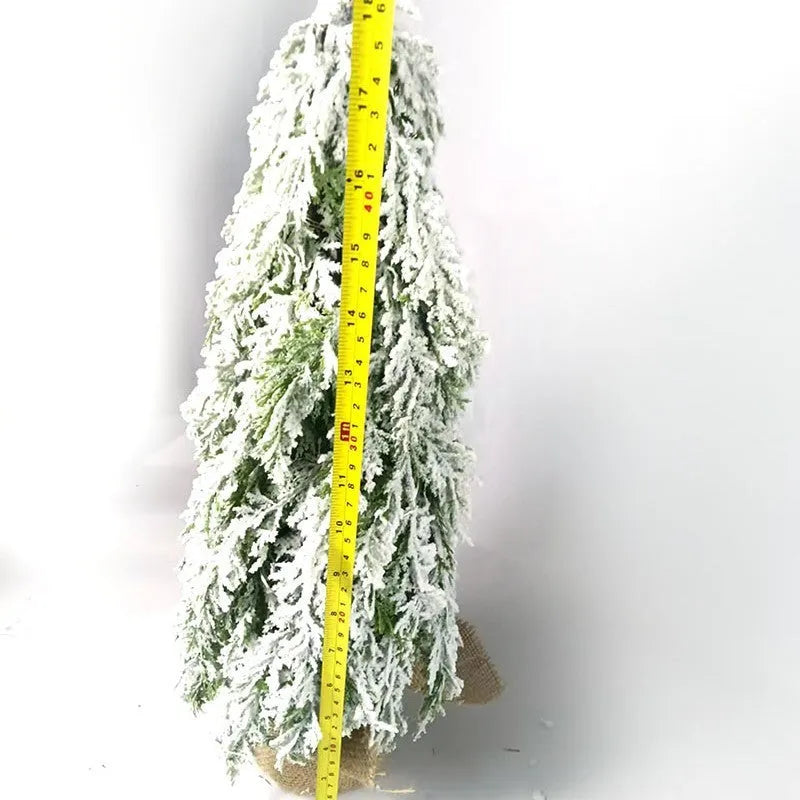 24-inch desktop artificial Christmas tree with LED lights and white snow finish on plastic branches
