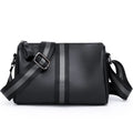 Black genuine leather one-shoulder crossbody bag showing its size and style.