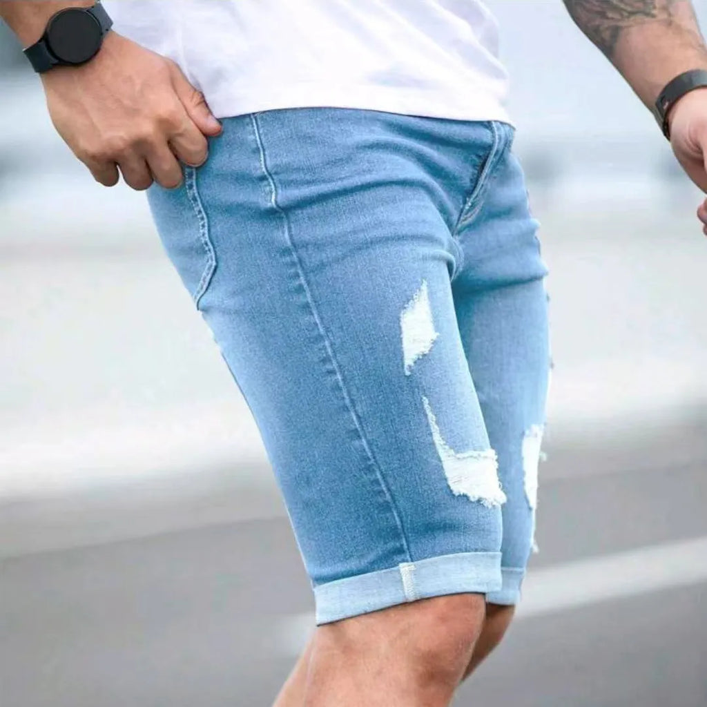 Sky blue men's denim shorts with a multi-hole design and low waist.