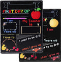 Wooden first day of school blackboard sign on a simple background.