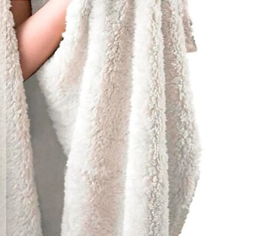 Round coral fleece burrito blanket with printed design on soft flannel fabric.