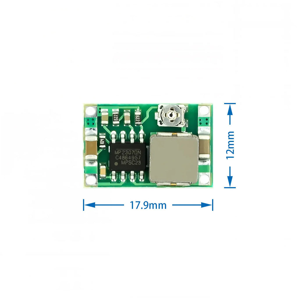 Mini-360 green DC-DC buck converter step down power module on white background