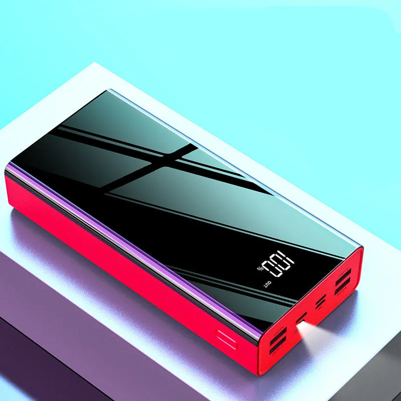 Red and black 40000mAh power bank with LCD display showing battery level.