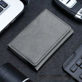 Leather tri-fold magnetic wallet card holder in black with embossed texture