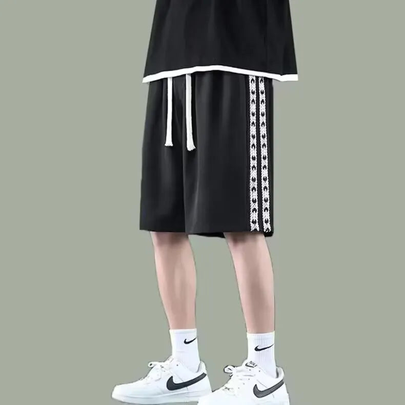 Men's loose-fitting track pants in black with micro-elastic construction and sports style design