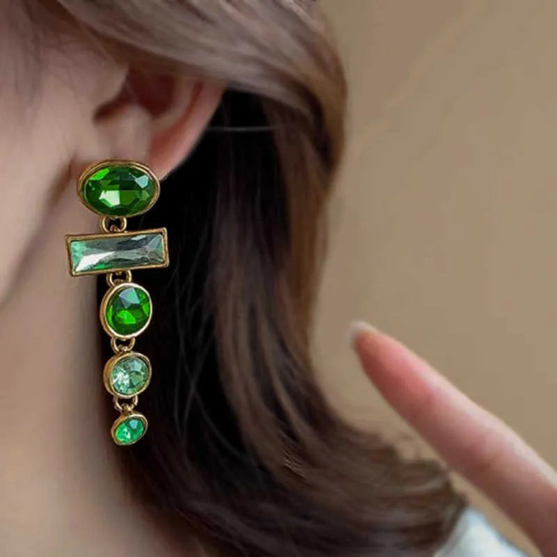 A pair of green gradient geometric drop earrings with alloy tassels and an inlaid zircon stone.