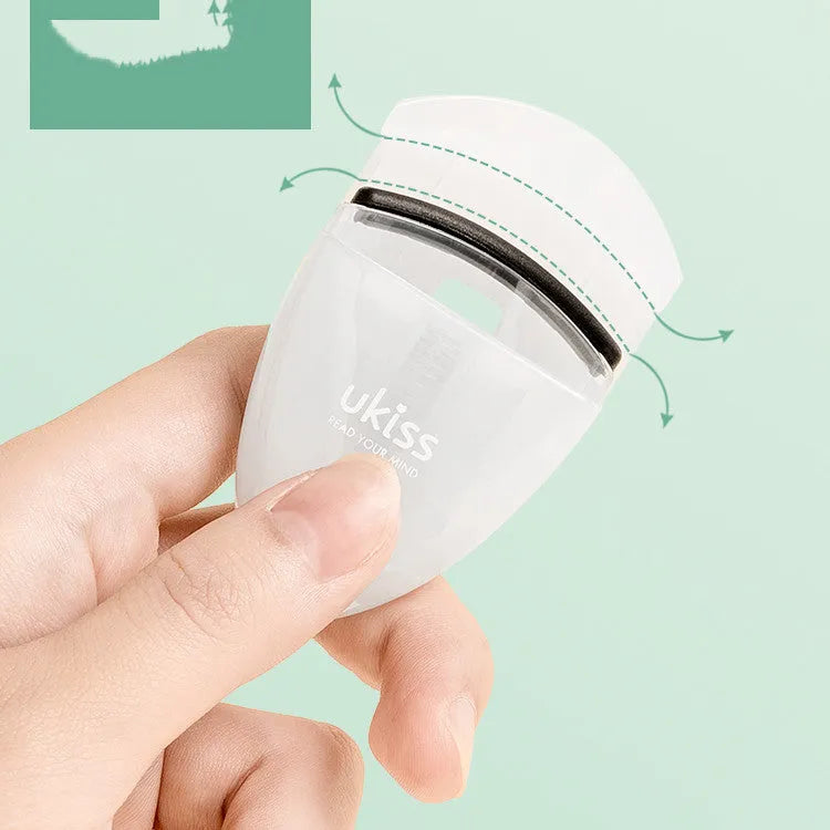 Mini portable eyelash curler in white with silicone pad and stainless steel arm