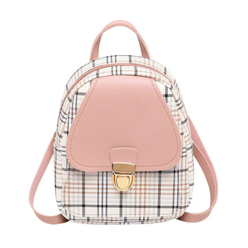 A black PU one shoulder diagonal phone bag worn crossbody, also shown held in hand.