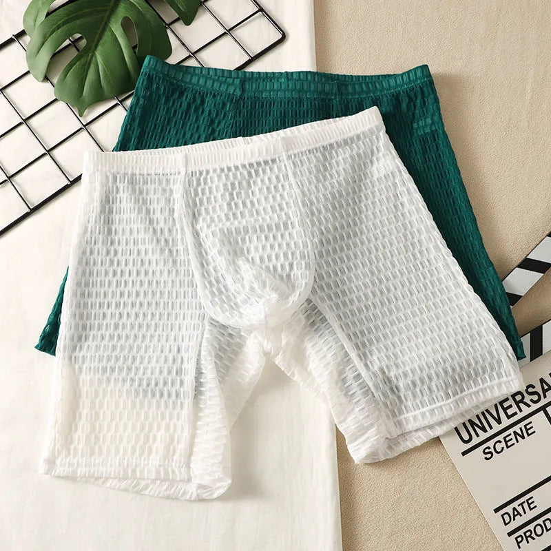 Men's white lace boxer shorts with lengthened cut and shaping function on mannequin