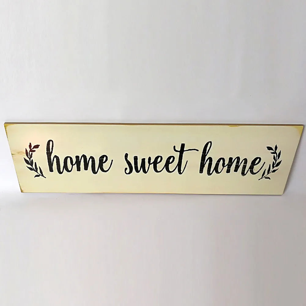 Carved wood Home Sweet Home hanging ornament in black, showing dimensions of 40cm wide.