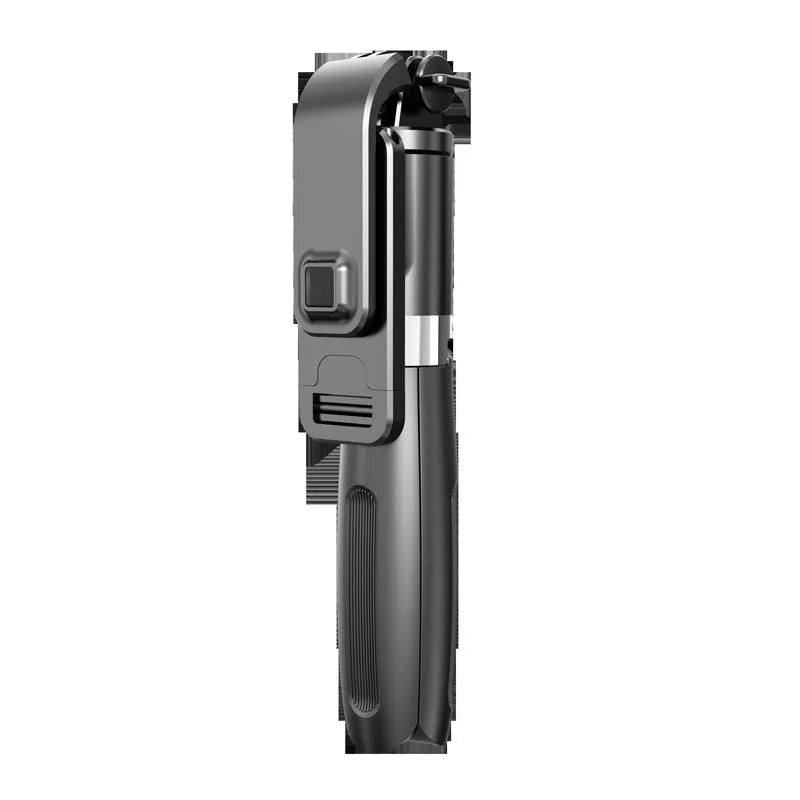 Black Bluetooth selfie stick extended with smartphone mounted, wireless remote control visible