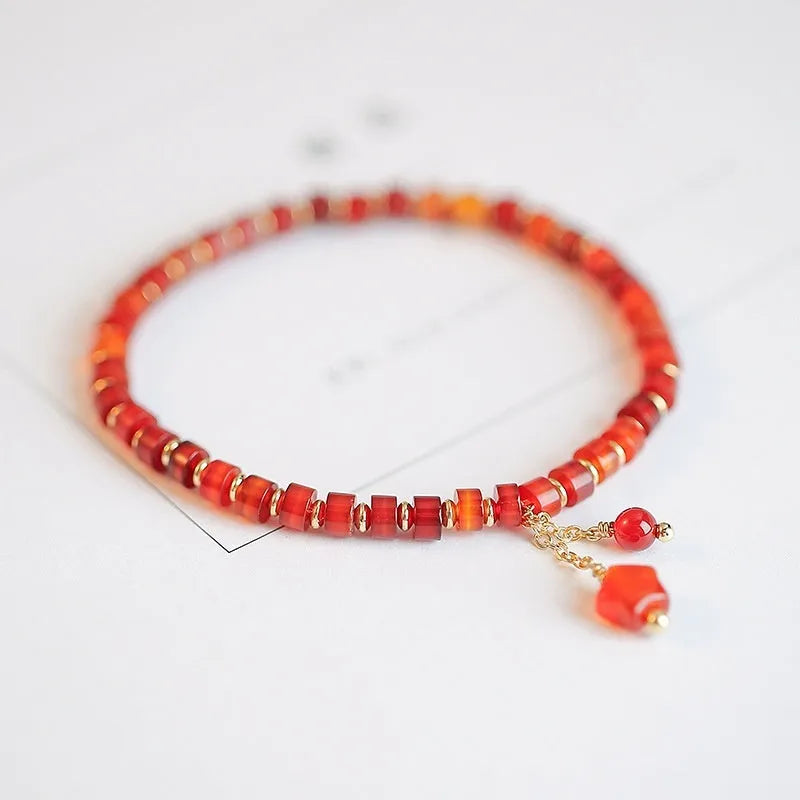 Hand-woven red agate bracelet with ethnic styling and electroplated finish