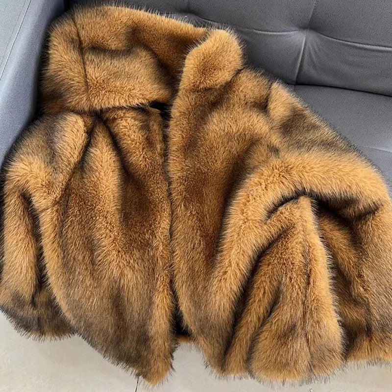 Silver grey artificial fur coat with 65cm length and loose fit on hanger