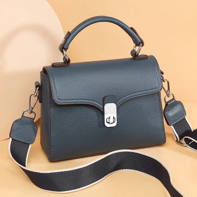 Korean commuter women's cross-body bag in genuine leather, oval shape, size 21x18x9cm, available in black