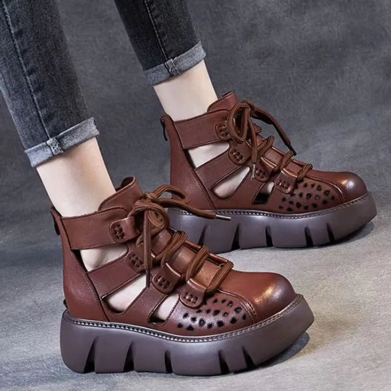 Women's black platform sandals with fish mouth toe and plush leather upper on a neutral background.