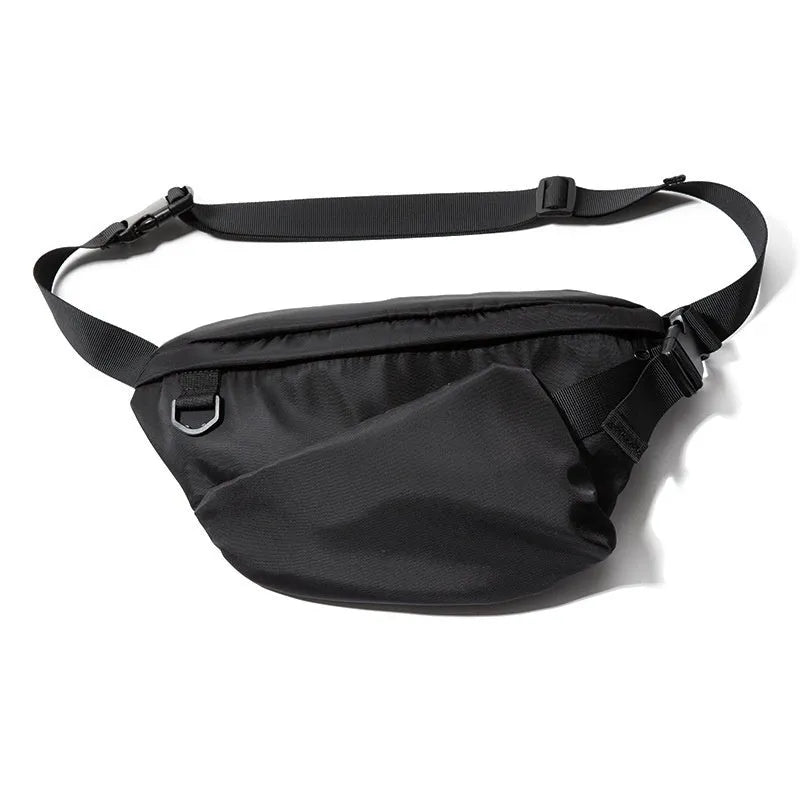 Black slanted chest bag with sewing line details, worn crossbody style