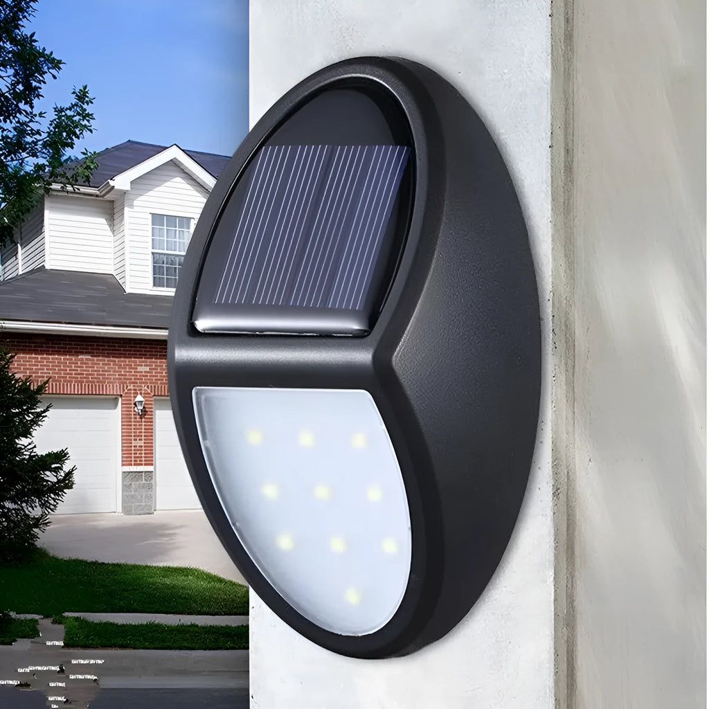 Black solar-powered LED wall light with motion sensor for outdoor security and garden lighting