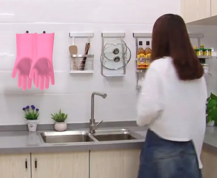 A pair of blue silicone cleaning gloves with a textured sponge-like surface for scrubbing.