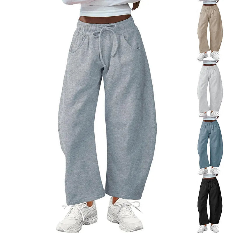 Loose cropped cotton sweatpants with drawstring waist and side pockets in street fashion style