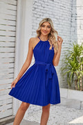 Women's black halter neck strapless sundress with pleated midi skirt and adjustable waist belt.