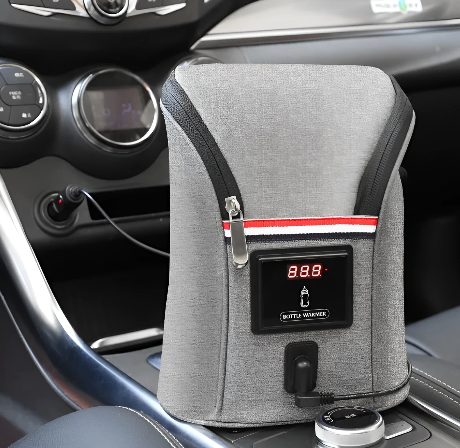 Grey Oxford cloth portable baby bottle warmer with carry handle and electronic display for car travel.