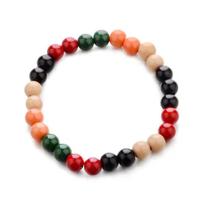 Natural stone bead bracelet with lava stones on a wrist, showing ethnic charm style and adjustable 18cm length.