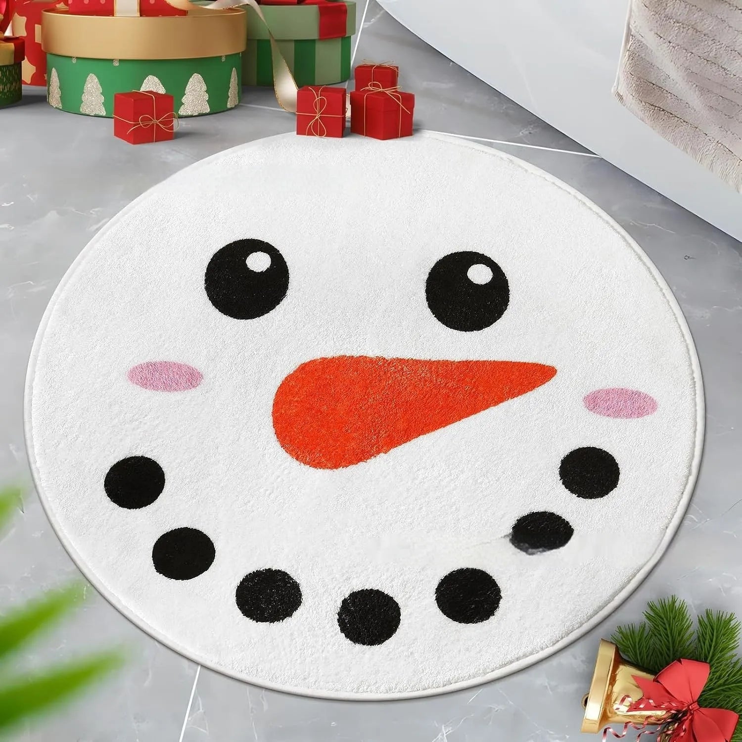 Round red and green Christmas pattern carpet on a wooden floor.