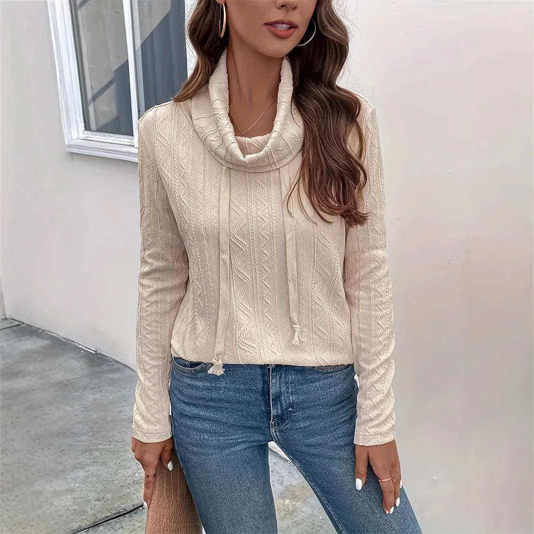 Apricot coloured long sleeve hooded pullover sweater with drawstring on mannequin