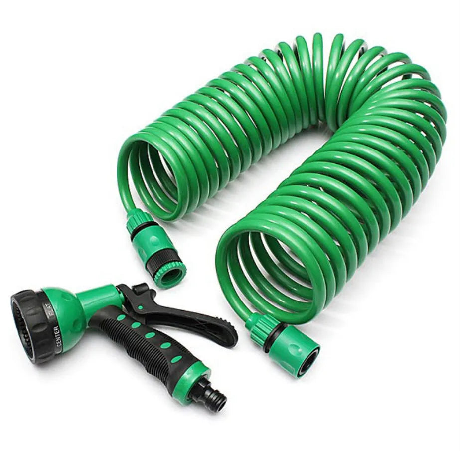 Garden telescopic hose sprinkler with ABS gun head extended on a lawn