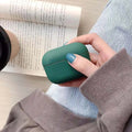 Plastic protective case for Apple AirPods Pro in various colours including black, pink, green, and blue.