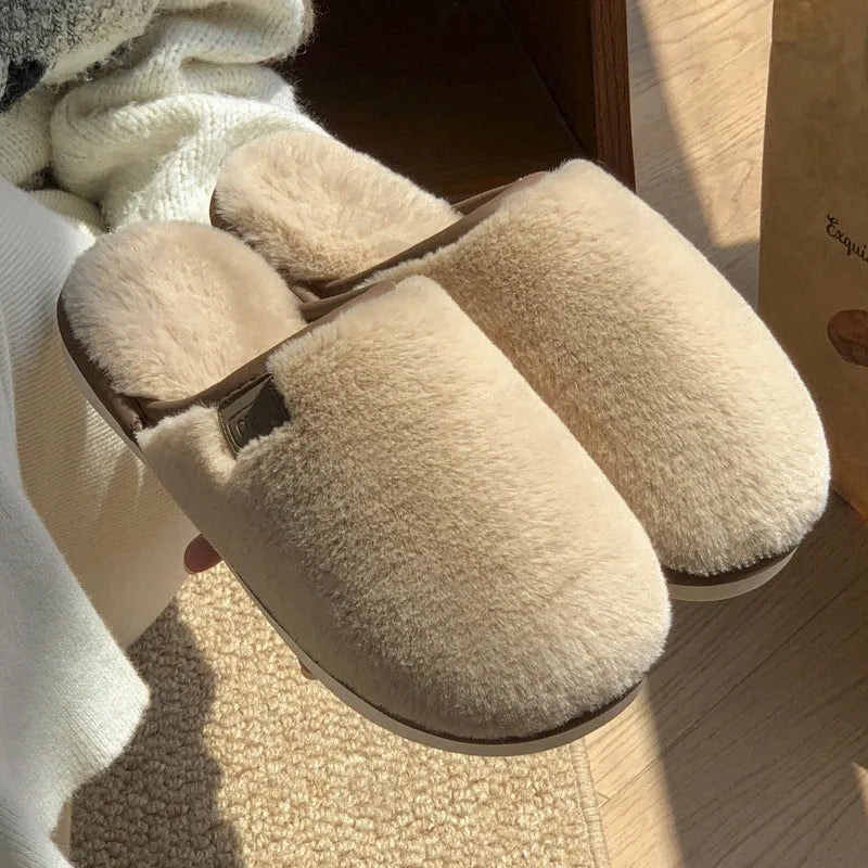 A pair of solid colour plush winter slippers with a non-slip PVC sole, shown in available colours.
