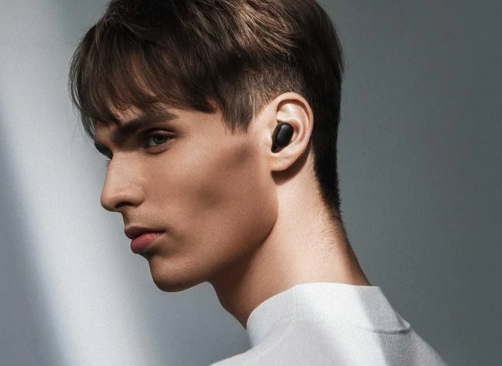 Redmi AirDots Black true wireless Bluetooth earbuds and charging case.