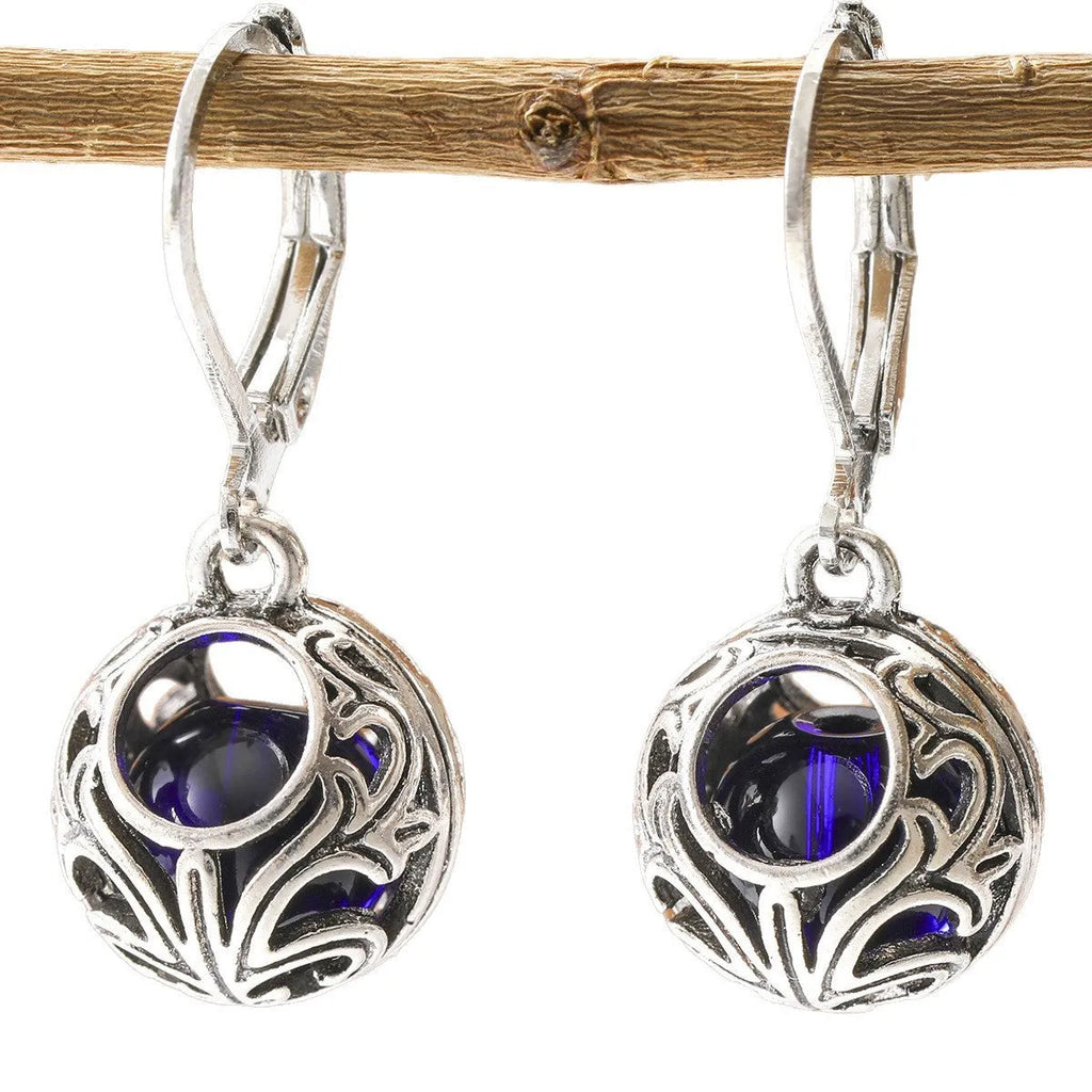 Women's silver geometric hollow pendant earrings with vintage engraving and blue gemstone accents