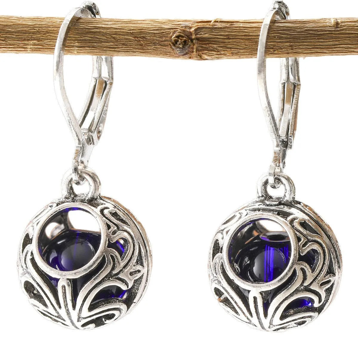 Women's silver geometric hollow pendant earrings with vintage engraving and blue gemstone accents