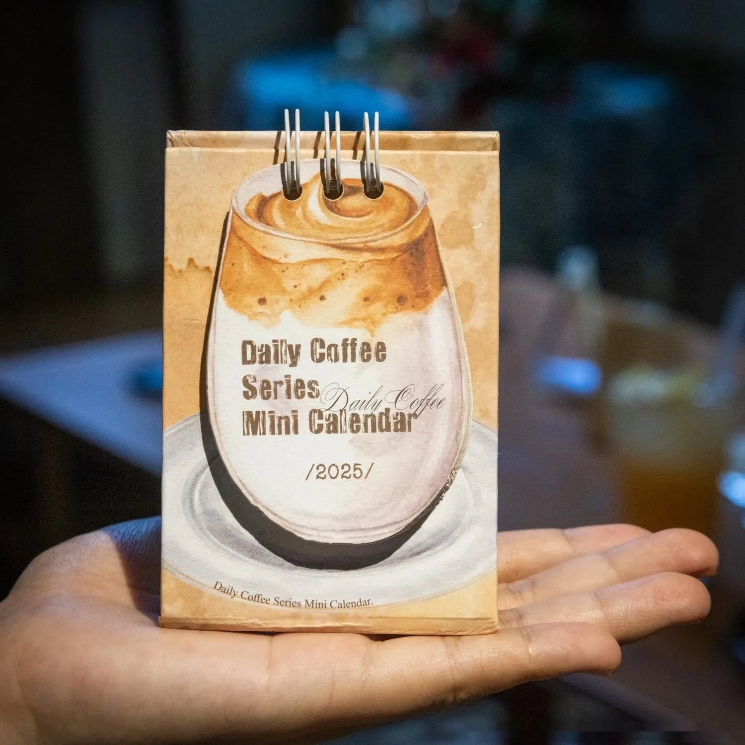 Mini 2025 desk calendar set showing four different themed designs including coffee and motivational messages.