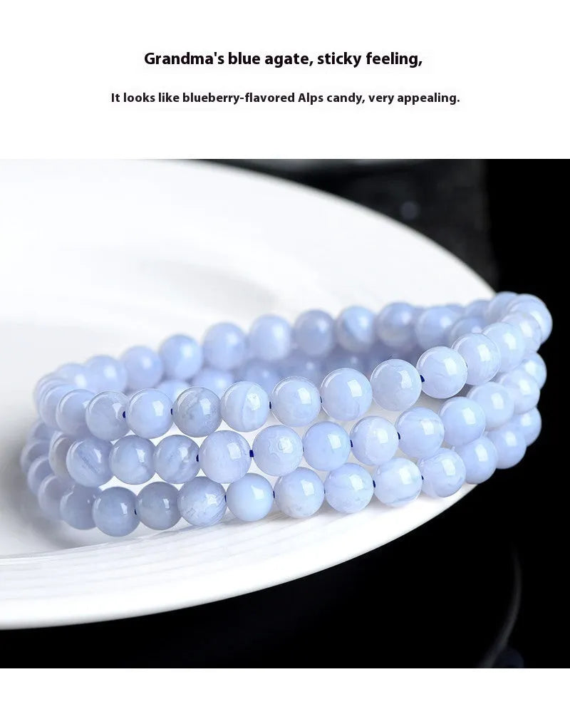 Natural blue agate bracelet with multi-circle patterns and scattered Ruyi elements on wrist