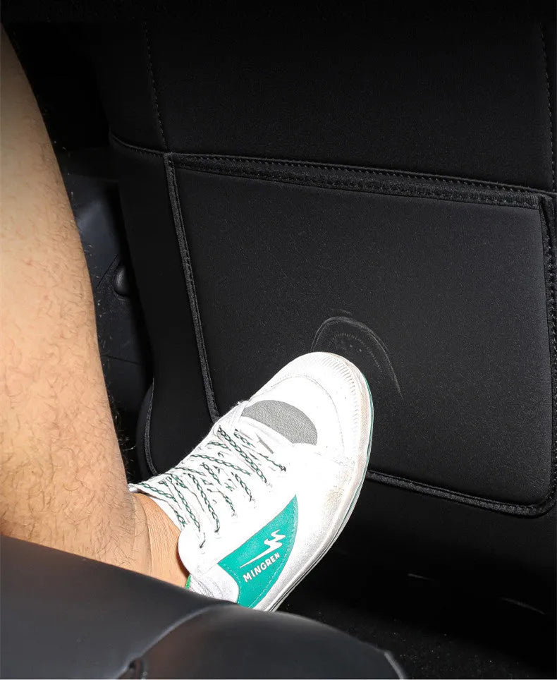 Black leather rear anti-kick pad for car seats measuring 68cm by 42cm