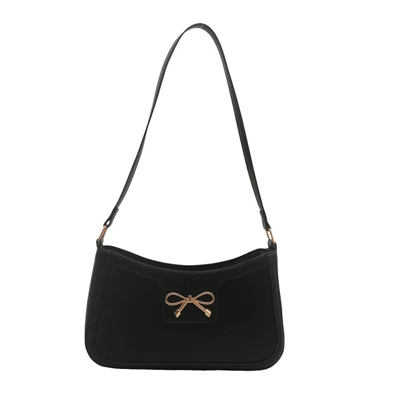 PU leather shoulder bag with bow decoration in a horizontal square shape, shown in one of six available colours.