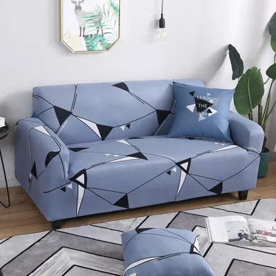 Stretchable geometric print sofa slipcover covering a three-seater sofa with matching pillow