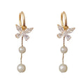 One pair of gold plated copper ear clips with butterfly pearl tassel design, clip-on style for women