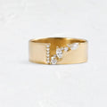 Gold electroplated copper women's fashion ring with shining zircon stones.