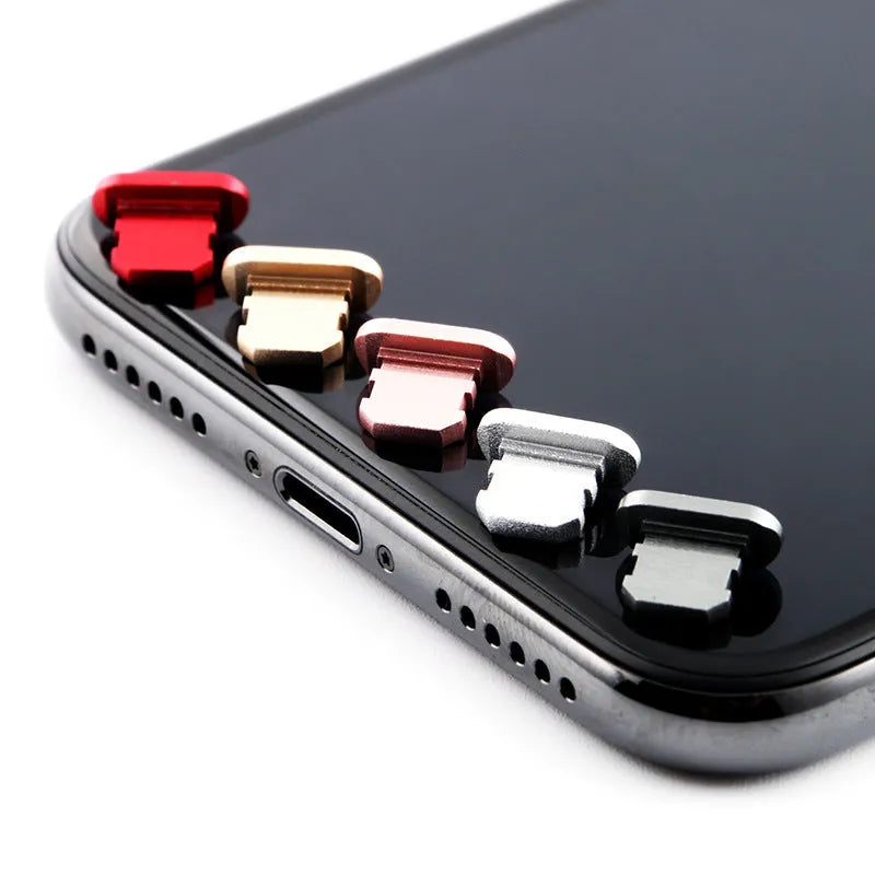 Aluminium alloy iPhone charging port dust plug shown in gold, silver, blue, red, grey, black, rose gold, and rose colours.