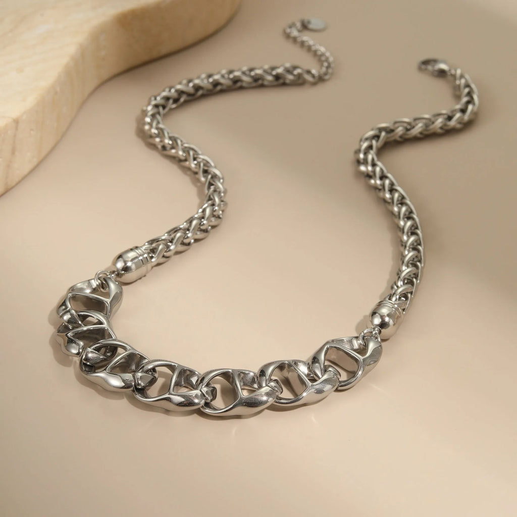 Women's stainless steel necklace with geometric pendant and gold plating on regular chain