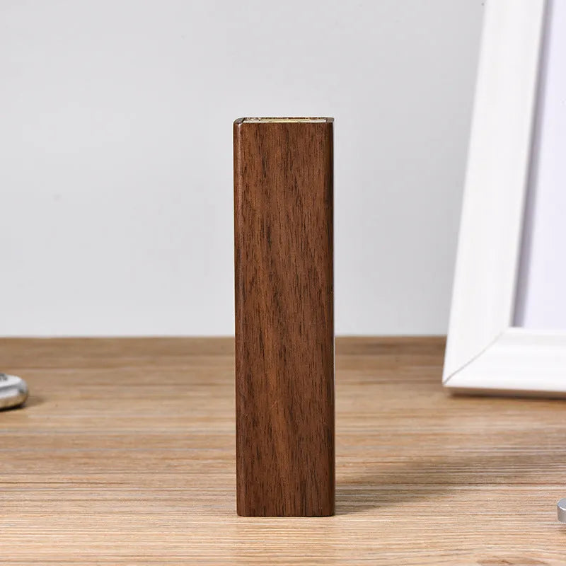 Solid walnut wood portable power bank with 2000mAh battery showing dimensions of 100mm x 25mm x 25mm