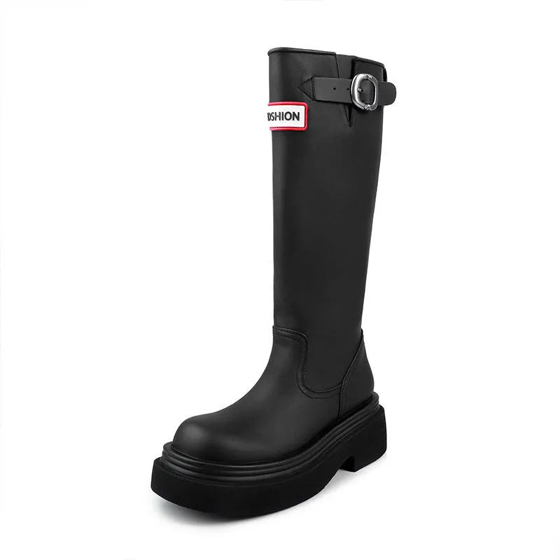 Black knight boots with thick platform sole and chunky heel, front view, showing round toe and high cylinder shaft.
