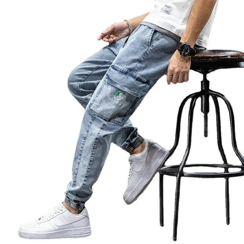 Men's loose straight-leg cargo jeans in blue, featuring a mid-rise waist and zip fly.