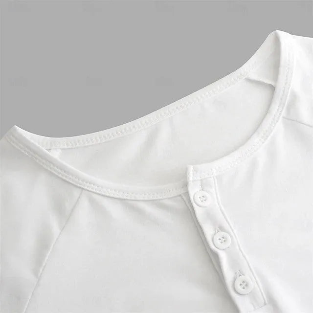 Men's white long-sleeved t-shirt with a Henry collar on a hanger.