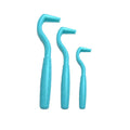 Set of three coloured tick removal hooks for dogs on a plain background.