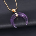 Close-up of a pink natural stone moon pendant necklace on a 45cm chain with electroplated copper fittings.
