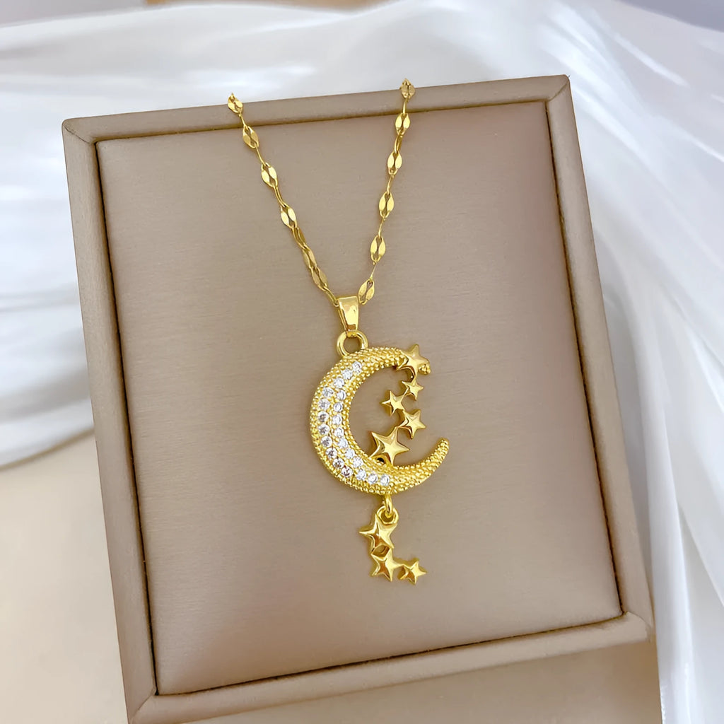 Moon tassel necklace with geometric design and diamond elements on stainless steel chain